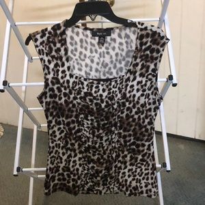 Leopard print sleeveless top.